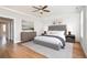 Spacious main bedroom showcases hardwood floors, neutral tones, and an ensuite bathroom entrance at 204 Phillips Ln, Alpharetta, GA 30009