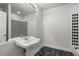 Powder room featuring a pedestal sink, marble floors, and decorative wall accents at 5300 Brooke Ridge Dr, Atlanta, GA 30338