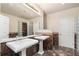 Bright bathroom featuring double sinks, large mirrors, and a glass block shower at 5300 Brooke Ridge Dr, Dunwoody, GA 30338