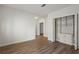 Bright bedroom featuring hardwood floors and a built-in closet at 5300 Brooke Ridge Dr, Dunwoody, GA 30338