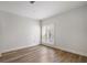 Bedroom with hardwood floors, white walls, and a shuttered window at 5300 Brooke Ridge Dr, Dunwoody, GA 30338