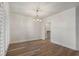 Dining room with wood floors, chandelier and plantation shutters at 5300 Brooke Ridge Dr, Dunwoody, GA 30338