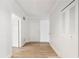 Bright hallway features clean, white walls, light wood floors, and doors for storage and access throughout the house at 5300 Brooke Ridge Dr, Dunwoody, GA 30338