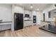 Kitchen featuring white cabinets, stainless steel appliances, granite counters, and wood floors at 5300 Brooke Ridge Dr, Dunwoody, GA 30338