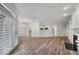 Spacious floorplan boasting natural light, wood floors, shutters and fireplace at 5300 Brooke Ridge Dr, Dunwoody, GA 30338