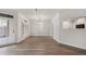 Open floor plan featuring wood floors, shutters and view to kitchen at 5300 Brooke Ridge Dr, Dunwoody, GA 30338