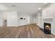 Spacious living area boasts wood floors, a cozy fireplace, and lots of natural light throughout at 5300 Brooke Ridge Dr, Dunwoody, GA 30338