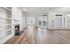 Bright living room boasts natural light, fireplace, and wood floors at 5300 Brooke Ridge Dr, Dunwoody, GA 30338