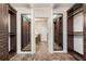 Walk-in closet featuring shelving and storage, with marble flooring at 5300 Brooke Ridge Dr, Dunwoody, GA 30338
