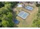 Aerial view of community amenities including a pool, tennis courts, playground and basketball court at 672 Red Sunset Cir, Powder Springs, GA 30127