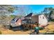 The home features a back deck, enclosed sunroom, and a playground set in the backyard at 672 Red Sunset Cir, Powder Springs, GA 30127
