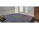 Bedroom with gray walls and carpet and door to the bathroom at 672 Red Sunset Cir, Powder Springs, GA 30127