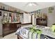 Bedroom with trophies, natural light, a ceiling fan, and dressers at 672 Red Sunset Cir, Powder Springs, GA 30127