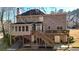 Two-story home with a large deck, stairs to the yard, and backyard view at 672 Red Sunset Cir, Powder Springs, GA 30127