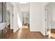 Bright and spacious foyer featuring gleaming hardwood floors and fresh white walls at 672 Red Sunset Cir, Powder Springs, GA 30127