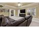 Cozy living room with a ceiling fan, television, and comfortable couch at 672 Red Sunset Cir, Powder Springs, GA 30127
