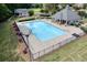 Community pool with sunning area, spa and nearby shade structure at 672 Red Sunset Cir, Powder Springs, GA 30127
