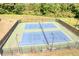 Aerial view of two well-maintained community tennis courts at 672 Red Sunset Cir, Powder Springs, GA 30127