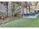 Well maintained backyard with patio, manicured lawn and plantings, and outdoor seating area at 680 Greenwood Ne Ave # 202, Atlanta, GA 30306