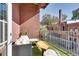 Cozy balcony with outdoor seating, a view of the surrounding neighborhood, and charming decor at 680 Greenwood Ne Ave # 202, Atlanta, GA 30306