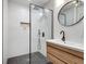Modern bathroom featuring a walk-in shower, wooden vanity, and sleek fixtures at 680 Greenwood Ne Ave # 202, Atlanta, GA 30306