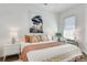 Inviting bedroom with a decorative headboard, colorful pillows, and ample natural light from a window at 680 Greenwood Ne Ave # 202, Atlanta, GA 30306