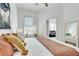Comfortable bedroom with a decorative print, natural light, and a view of the living area at 680 Greenwood Ne Ave # 202, Atlanta, GA 30306