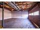 Unfinished basement with a concrete floor and exposed ceiling and rafters at 940 Highview Se Dr, Smyrna, GA 30082