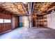 Unfinished basement with hot water heater, open shelving and an unfinished ceiling at 940 Highview Se Dr, Smyrna, GA 30082