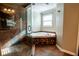 A bathroom featuring tile floors, a glass-enclosed shower, and a bathtub with decorative tile at 940 Highview Se Dr, Smyrna, GA 30082