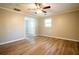 A spacious bedroom with updated flooring, two windows providing natural light, and a ceiling fan at 940 Highview Se Dr, Smyrna, GA 30082