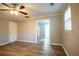 Bedroom with updated flooring, paint, ceiling fan, and view into another room at 940 Highview Se Dr, Smyrna, GA 30082