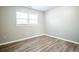 Bedroom featuring a window and modern flooring at 940 Highview Se Dr, Smyrna, GA 30082