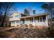 Charming two-story home with siding, well-manicured lawn, and welcoming front porch at 940 Highview Se Dr, Smyrna, GA 30082