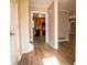Inviting foyer with wood-look flooring that flows into the living spaces, and a view of the kitchen at 940 Highview Se Dr, Smyrna, GA 30082