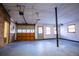 This spacious garage has high ceilings, concrete floors, and a roll up door to the exterior at 940 Highview Se Dr, Smyrna, GA 30082