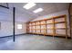 Large garage with tall ceilings, a concrete floor, and fluorescent lighting at 940 Highview Se Dr, Smyrna, GA 30082