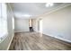 A large living room with updated flooring, neutral paint, and natural light, perfect for entertaining at 940 Highview Se Dr, Smyrna, GA 30082