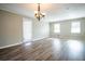 Spacious living room with a back door, windows, and modern flooring at 940 Highview Se Dr, Smyrna, GA 30082