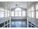Bright sun room featuring a vaulted ceiling, large windows and slate floors at 940 Highview Se Dr, Smyrna, GA 30082
