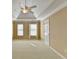 Bedroom with tray ceiling and neutral-toned walls at 1059 Swaying Pines Trce, Marietta, GA 30066