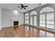 Spacious living room with hardwood floors, fireplace, and large windows at 1059 Swaying Pines Trce, Marietta, GA 30066