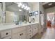 Main bathroom features a double vanity, a large mirror, and updated fixtures at 2131 Independence Ln, Buford, GA 30519