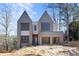 Contemporary home with gray brick, gabled roof, and a two-car garage at 2369 Drew Valley Ne Rd, Atlanta, GA 30319