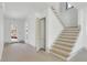Bright hallway featuring stairs with wood treads and an exterior access door at 2369 Drew Valley Ne Rd, Atlanta, GA 30319