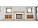 Close up of the living room fireplace with unfinished wood frame and built-in shelving at 2369 Drew Valley Ne Rd, Atlanta, GA 30319