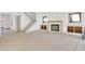 Open concept living area featuring fireplace, stairs, and exterior door at 2369 Drew Valley Ne Rd, Atlanta, GA 30319