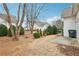 Well-maintained backyard featuring green shrubbery and manicured landscaping at 2414 Clock Face Ct, Lawrenceville, GA 30043