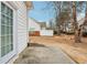 Backyard featuring an adjacent white home and manicured lawn at 2414 Clock Face Ct, Lawrenceville, GA 30043