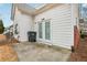 Backyard showing white vinyl siding, French doors, and trash receptacle at 2414 Clock Face Ct, Lawrenceville, GA 30043